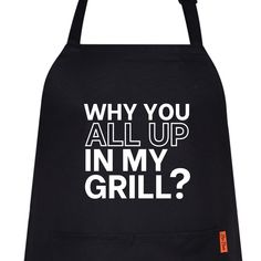 a black apron that says, why you all up in my grill? on it