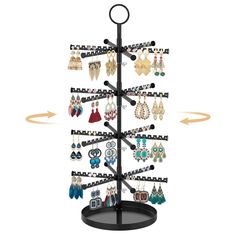 a jewelry rack with earrings on it and an arrow pointing up to the earring holder