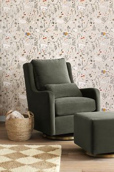 a chair and ottoman in front of a floral wallpaper