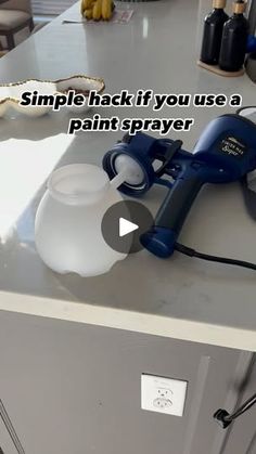 a counter top with a hair dryer and soap dispenser on it