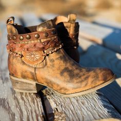 We love the whiskey hue of this sweet little bootie! It has a stretch ankle for comfort and an adorable harness around the ankle made of leather and concho accents. The leather is finished off perfectly with rose gold burnishing. Brown Harness, Skirt Ideas, Fun Shoes, Native American Clothing, Girl Boots, Handmade Boot, Winter Skirt