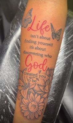 a person with a tattoo on their arm that says, life isn't about finding yourself it's about discovering who god created you to be