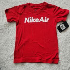 Nike Young Boy T-Shirt Nwt Boy Sz 6 Color: University Red/White Nike Red T-shirt For Summer, Red Nike T-shirt For Summer, Nike Red Graphic Tee, Nike Red Graphic Tee Top, Spring Red T-shirt With Logo Print, Red Short Sleeve Shirt With Logo Print, Basic Red T-shirt With Logo Print, Tops Nike, Nike Red