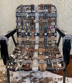 a chair made out of many different types of buttons on it's back and sides