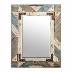 a mirror that is made out of wooden planks and has metal fittings on the sides