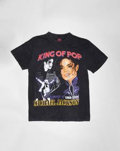 Get your hands on this awesome Michael Jackson t-shirt! Made from 100% cotton it has short sleeves, a round neck and comes in a regular fit. Features several images of Michael on the front and the text 'Michael Jackson, King of Pop. Mint vintage condition 100% Cotton Chest 36" Length 26" M/L Pop Culture Cotton T-shirt With Graphic Print, Pop Culture Concert T-shirt With Short Sleeves, 90s Cotton T-shirt With Front Print, Black T-shirt With Pop Culture Sublimation Print, Cotton Graphic Print T-shirt For Concerts, Band Merch Short Sleeve Graphic T-shirt, Short Sleeve Graphic T-shirt Band Merch, Vintage Black T-shirt With Graphic Design, Short Sleeve T-shirt With Graphic Design For Concert