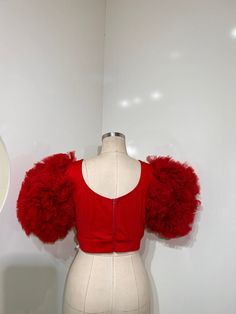 A fusion of boldness and elegance. Crafted from luxurious tulle fabric, this top boasts a vibrant red hue that exudes freshness and vitality. The plunging neckline adds a touch of allure, while the cropped length offers a modern twist. Perfect for making a statement at parties or special occasions, this top pairs effortlessly with high-waisted trousers or a sleek skirt. DETAILS Fitted Plunging neck short sleeve Waist band Zip closure SIZE & FIT length 15” Sleeve length 10.5” Bust 34” waist 30 Size M African Suit, Skirt Details, Plunging Neck, Belted Pants, Dress Home, Tulle Fabric, High Waisted Trousers, British Indian, Plunging Neckline