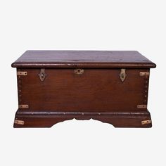 an old wooden trunk with brass handles and latches on the top, sitting against a white background