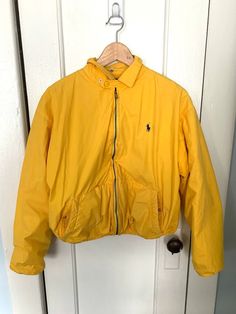 "Vintage Polo Ralph Lauren Yellow Jacket Made in Hong Kong Womens size M MADE IN HONG KONG 100% COTTON Lined 80% Cotton 20% Acrylic Has kind of a puffer look Short jacket Boxy fit Small or medium Chest:44\" Total Length:22\" Sleeve Length :29 More vintage clothing: https://www.etsy.com/shop/ElectricEyeThrift?sort_order=price_desc§ion_id=27044881 ✶ VINTAGE ✶ Please note that this item is vintage. Wear and tear representative of its age may be present. Anything major will be in the description, bu Casual Yellow Track Jacket For Fall, Yellow Long Sleeve Track Jacket For Winter, Vintage Yellow Long Sleeve Windbreaker, Yellow Vintage Long Sleeve Windbreaker, Casual Yellow Long Sleeve Track Jacket, Yellow Jacket Outfit, Polo Ralph Lauren Jacket, Cropped Faux Fur Coat, Ralph Lauren Jacket