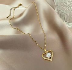 High Quality 18k Gold Plated Heart Necklace Jewelry Zirconia Love Pendant Ladies Necklace. Ideal to wear in any occasion or party Perfect in any outfits. Most popular with high quality crystal and gold plated. Valentine's Day Party Heart Necklace In Cubic Zirconia, Elegant Cubic Zirconia Heart Necklace For Party, Gold Heart Necklace For Mother's Day Party, Elegant Crystal Heart Necklace For Valentine's Day, Gold Heart Pendant Necklace With Cubic Zirconia, Gold Cubic Zirconia Heart Pendant Necklace, Gold Crystal Heart Pendant Necklace, Gold Plated Heart Necklace For Party, Gold Crystal Heart Necklace