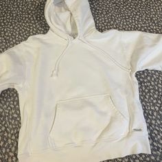 Brand New Without Tags. Sporty White Sweatshirt With Kangaroo Pocket, White Relaxed Fit Top With Adjustable Hood, White Sporty Hoodie With Kangaroo Pocket, White Sporty Top With Kangaroo Pocket, White Urban Hoodie With Kangaroo Pocket, Sporty White Top With Kangaroo Pocket, White Relaxed Fit Sweatshirt With Kangaroo Pocket, Cozy White Cotton Hoodie, White Athleisure Top With Kangaroo Pocket