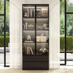 a book case with many books on it in the middle of a floor to ceiling window