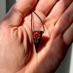 The pendant is made of black stabilized hornbeam wood The engraving is filled with red jewelry resin Black Symbolic Necklace With Large Pendant, Symbolic Black Necklace With Large Pendant, Black Symbolic Jewelry With Large Pendant, Symbolic Black Jewelry With Large Pendant, Gothic Carved Jewelry Gift, Unique Black Pendant Necklace, Unique Black Necklaces For Gifts, Unique Black Necklace For Gift, Black Carved Symbolic Necklace