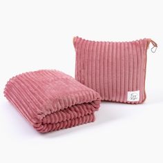 the pink corded pillow and throw are both made out of fabric