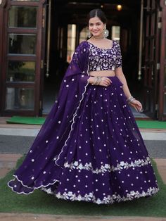 Introducing our fabulous violet embroidered georgette function wear lehenga choli, the perfect outfit for your special occasions. This stunning ensemble features a violet color georgette lehenga with heavy sequin and embroidered work, paired with a matching georgette choli adorned with heavy sequin work and multi-embroidered detailing. The look is completed with a georgette dupatta featuring sequin multi-embroidered arco cut work and designer lace work.
This outfit includes high-quality georgett Ceremonial Wedding, Purple Lehenga, Heavy Lehenga, Lehenga Crop Top, Indian Lehenga Choli, Lehenga Choli Wedding, Floral Lehenga, Party Wear Lehenga Choli, Zari Embroidery