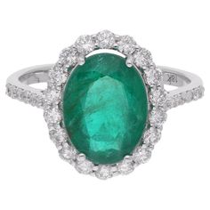 Item Code :- SER-24014 Gross Wt. :- 3.98 gm 18k Solid White Gold Wt. :- 3.12 gm Natural Diamond Wt. :- 0.68 Ct. ( AVERAGE DIAMOND CLARITY SI1-SI2 & COLOR H-I ) Emerald Wt. :- 3.64 Ct. Ring Size :- 7 US & All size available ✦ Sizing ..................... We can adjust most items to fit your sizing preferences. Most items can be made to any size and length. Please leave a note at checkout or contact us via 1stDibs conversation. Even after purchasing the item, you can still ask us to adjust the size or length. We will try our best to fix it if it is possible. ✦ Import Duties, Taxes and Custom Charge ..................... Import duties, taxes and customs charges are not included in the items price or shipping cost. These charges are the buyer's responsibility. Please check with your country's Cocktail Ring Diamond, Zambian Emerald, Diamond Cocktail Rings, Modern Ring, Emerald Gemstone, Ring Diamond, Gem Stone, Cocktail Ring, Diamond Clarity