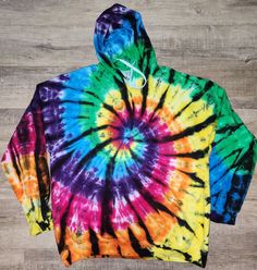 Processing time is 2 weeks. 80/20 cotton/poly blend hoodies it won't be exact to the listing photo but similar to it each one will be unique.  Wash along the first few washes on cold water. Tumble dry on low heat or air dry(recommended) Rainbow Hoodie, Reverse Tie Dye, Ice Dyeing, Graphic Shirts, Air Dry, Cold Water, Beauty Book, Gender Neutral, Etsy Accessories