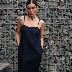 "Our Elegantly timeless Linen Slip Dress is versatile, making it an ideal choice for both the summer season and perfect for pairing with long sleeves t-shirt on cooler days. This Linen dress features a classic A-line silhouette with a square neckline and adjustable spaghetti straps. Side pockets add functionality. Wear this versatile Cami Dress solo or pair it with a long-sleeved t-shirt, a shirt, or a jacket - whatever suits your preference. DETAILS ⚬ Adjustable spaghetti straps. ⚬ Square neckline. ⚬ Deep side pockets. ⚬ Made of organic Oeko-Tex-certified linen. ⚬ The linen is NOT see-through. ⚬ Shown here in Midnight blue. FIT / SIZE ⚬ Designed for a slightly loose fit. ⚬ Mid-calf length.  If you would like to add or subtract 10cm from the length, please let us know. ⚬ Handmade to order Fitted Cotton Slip Dress For Summer, Black Casual Slip Dress For Summer, Casual Dresses With Spaghetti Straps And Relaxed Fit, Casual Spaghetti Strap Dresses With Relaxed Fit, Casual Relaxed Fit Dress With Spaghetti Straps, Casual Slip Dress With Adjustable Straps For Vacation, Casual Sundress With Adjustable Straps And Straight Neckline, Casual Unlined Slip Dress For Summer, Casual Slip Dress For Spring