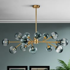 a chandelier hanging from the ceiling in a living room