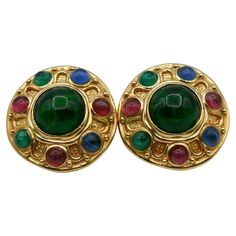 CHRISTIAN DIOR vintage gold tone clip-on earrings embelisshed with multicolour (green, red and blue) marbled glass cabochons. Embossed CHR. DIOR © GERMANY. Indicative measurements : diameter approx. 3.5 cm (1.38 inches). Weight per earrings : approx. 22 grams. Material : Gold tone metal hardware / Glass. NOTES - This is a preloved vintage item, therefore it might have imperfections. - Colors may differ slightly from actual product appearance due to differences in lighting conditions. - As a buyer, you are fully responsible for customs duties, other local taxes and any administrative procedures related to imports into the country of destination. Dior Vintage, Metal Hardware, Gold Tone Metal, Vintage Earrings, Vintage Gold, Clip On Earrings, Christian Dior, Metallica, Red And Blue