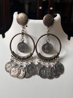 Oxidized coin earrings handmade jewelry from India Round Coin Pendant Earrings For Gifts, Round Coin Pendant Earrings As Gift, Round Metal Clip-on Earrings, Silver Coin Pendant Earrings For Gift, Silver Earrings With Coin Pendant As Gift, Silver Earrings With Coin Pendant For Gift, Vintage Earrings With Coin Pendant For Gift, Vintage Silver Medallion Earrings, Vintage Coin Pendant Earrings For Gift