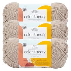 three balls of yarn with the words color theory written on them in orange and white