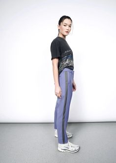 Cropped at the ankle, the Empower Slim Crop Pant has the perfect combination of soft, stretchy, breathable material and a tailored mid rise fit. Now featuring a classic inset 'tuxedo' stripe, this item is a true closet must-have. Mix and match with other items in the Empower Collection for maximum versatility. Fitted Bottoms With Side Stripes For Streetwear, Athleisure Work Pants With Elastic Side Panels, Sporty Straight Leg Bottoms With Contrast Stripes, Contrast Stripes Bottoms For Workwear, Fitted Athleisure Pants With Straight Hem, Sporty Fitted Pants With Straight Hem, Fitted Bottoms With Elastic Side Panels For Streetwear, Athleisure Straight Leg Bottoms With Side Stripes, Casual Fitted Bottoms With Side Stripes