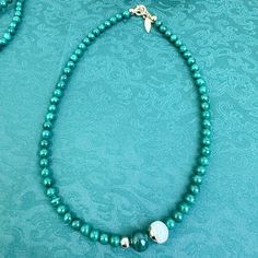 This round malachite short necklace with its freshwater pearl embellishments will add a touch of sophistication and exclusivity to any outfit. Its simple and elegant design will elevate any look, and when worn with a long necklace, or styled as part of a layering ensemble. It will be contained in a nice jewelry box with well packed. Elegant Green Onyx Beaded Necklaces, Turquoise Round Beads Emerald Necklace, Elegant Single Strand Malachite Jewelry, Elegant Green Malachite Necklace, Elegant Green Malachite Beaded Necklace, Elegant Malachite Gemstone Beads Jewelry, Elegant Green Onyx Bead Necklaces, Elegant Single Strand Green Onyx Necklace, Elegant Green Onyx Round Necklaces