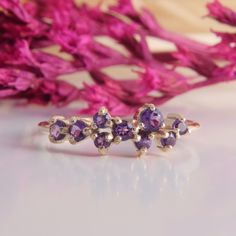 Gold Cluster Wedding Band, Womens Amethyst Cluster Ring, Dainty Cluster Wedding Band, Gold Amethyst Ring, Purple Stone Ring,Amethyst Jewelry WE OFFER UNLIMITED PERIOD INSTALLMENTS PLAN This is a beautiful, stunning, feminine ring that works well for all occasions, styles, and ages. You will love it! Ring information: Stones: Amethyst Approximate size: 3.0mm (1 stone) Approximate size: 2.5mm (3 stones) Approximate size: 2.0mm (5 stones) Metal type: Gold Metal stamp: 14k Gold Installment Payments Fine Jewelry Amethyst Stackable Wedding Rings, Wedding Amethyst Stackable Rings Fine Jewelry, Wedding Amethyst Gemstone Stackable Rings, Amethyst Gemstone Stackable Rings For Wedding, Purple Amethyst Stackable Wedding Rings, Purple Cluster Ring For Weddings, Fine Jewelry Style, Purple Gemstone Stackable Rings For Wedding, Purple Multi-stone Cluster Ring For Anniversary, Purple Multi-stone Amethyst Ring For Wedding