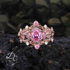 3PCS Vintage Oval Pink Sapphire Engagement Ring Sets Nature Inspired Cluster Promise Ring Rose Gold Art Deco Leaf  Pink Gemstone Branch Ring --->Ring details: - Theme:Romantic Wedding & Engagement - comfortable band - Center Stone : Lab sapphire - Carat: 6*8mm - Side stone :Lab sapphire +  moissanite - Side stone:0.48ctw - wedding band :Lab opal + Lab sapphire +moissaanite - 0.12ctw  Materials: - 14k rose gold/14k white gold /14k yellow gold --->Accessories: - beautiful jewelry boxes, and some o Formal Pink Rings With Intricate Design, Rose Gold Oval Crystal Ring With Birthstone, Oval Rose Design Jewelry For Wedding, Pink Oval Flower Ring For Wedding, Oval Rose Gold Crystal Ring With Birthstone, Pink Gold Jewelry With Oval Accent Stones, Handmade Oval Rose Gold Rings, Pink Gold Oval Jewelry With Accent Stones, Rose Oval Jewelry With Rose Design