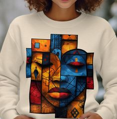 This cute colorful sweatshirt with African art aesthetic makes a great gift. Cozy and comfortable, making it ideal for colder months. Please note: Due to variations in display settings, the shirt color might look slightly different on your screen than in person. Processing Time: - 2 to 5 Business days processing time.  Return Policy: - All items are made-to-order. Therefore, we can't accept returns unless they arrive damaged or defective. Ideal for any situation, a unisex heavy blend crewneck sw African Art Aesthetic, Art Sweatshirt, Colorful Sweatshirt, Afrocentric Art, African Design, Art Aesthetic, Shirt For Women, African Art, Cut And Style