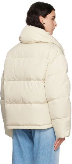 Acne Studios.Off-White Quilted Down Jacket.Down-filled quilted recycled polyester taffeta jacket..· Funnel neck.· Zip closure with press-stud placket.· Logo printed at chest.· Concealed bungee-style drawstring at hem.· Full recycled nylon taffeta lining.Supplier color: Milk white.Fill: 90% recycled down, 10% feather..Body: 100% recycled polyester. Lining: 100% recycled nylon..Made in China..232129F061005 Beige Nylon Puffer Jacket With Padded Collar, White Quilted Puffer Jacket With Long Sleeves, White Quilted Puffer Jacket, White Long Sleeve Quilted Puffer Jacket, White Down Outerwear With Padded Collar, Winter White Nylon Puffer Outerwear, Winter White Quilted Nylon Outerwear, Quilted Nylon Outerwear In Winter White, White Puffer Quilted Jacket For Winter