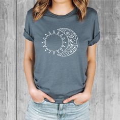 Women's Bella Tri-Blend relaxed unisex fit T-shirt with a Sun and Moon screen printed graphic design.  Super soft, stretchy, and comfy material.   Available with black or white ink! FIT: Follow the image size chart Unisex Fit - Runs Large - Long Length  Suggest sizing down if you prefer a more fitted look instead of relaxed -  Bella 3.8 oz  Super Soft hand and lightweight  -  Tri Blends:  50% Poly, 25%  Cotton, 25%  Rayon -  Does not shrink -  Hand screen printed to order in Oregon - Model is wearing a size small Fashion Fitted Style  http://etsy.me/2qjx3lC ♥ All of our tees are hand-printed to order in our shop in Portland Oregon! ♥ RETURNS & EXCHANGES We gladly accept exchanges and returns if not worn.   Please follow the chest measurement size guide for fit if you are unsure.  We custom Casual Short Sleeve T-shirt With Moon Print, Casual Summer T-shirt With Sun And Moon Design, Casual Moon Print Short Sleeve T-shirt, Relaxed Fit Moon Print Short Sleeve Tops, White Casual T-shirt With Moon Print, Trendy Crew Neck T-shirt With Moon Print, Trendy Cotton T-shirt With Moon Print, Casual Cotton T-shirt With Moon Print, Moon Print Relaxed Fit Crew Neck T-shirt