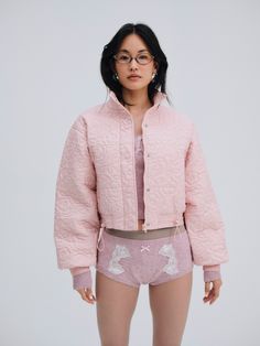 For Love & Lemons Essentials: For an on and off-the-clock outerwear piece, look no further than the Rylee pink puffer coata cropped puffer jacket crafted in a quilted floral fabric. It's finished with ribbed cuffs, a stand collar, and snap buttons for a utilitarian, wear-everyday look. Quilted Cotton Puffer Jacket For Spring, Spring Cotton Quilted Puffer Jacket, Trendy Cotton Puffer Jacket For Spring, Spring Pink Puffer Jacket With Padded Collar, Pink Spring Puffer Jacket With Padded Collar, Pink Puffer Jacket With Padded Collar For Spring, Long Sleeve Puffer Quilted Jacket For Spring, Spring Long Sleeve Puffer Quilted Jacket, Fitted Quilted Spring Puffer Jacket