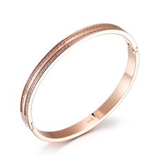 Durable and stylish, our waterproof bracelet is crafted for both functionality and fashion. Perfect for any occasion, it's the ideal accessory for those who appreciate durability and timeless elegance. Perfect for the minimalist and a beautiful piece to layer with. - 18K gold plated / stainless steel - Waterproof technology - Bangle opens and measures 56mm inner diameter. - 3mm in width. - Cubic Zirconia Modern Adjustable Rose Gold Bracelets, Adjustable Rose Gold Cuff Bracelet, Tarnish Resistant, Adjustable Tarnish-resistant Rose Gold Cuff Bracelet, Trendy Rose Gold Stainless Steel Bracelets, Adjustable Yellow Gold Stainless Steel Bangle, Elegant Stainless Steel Cuff Bracelet For Everyday, Elegant Everyday Stainless Steel Cuff Bracelet, Luxury Rose Gold Bracelets For Everyday, Classic Rose Gold Metal Bracelets