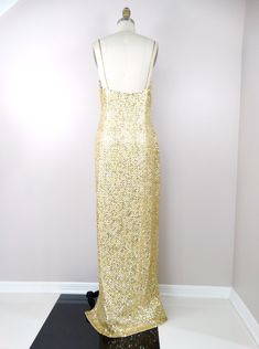 "This is a show-stopping gown. It's fully embellished with shiny gold, metallic gold, iridescent gold sequins and accented with tiny gold beading between each and every sequin. Absolutely amazing and it's in perfect condition! Measurements: Bust - 38-42\" Waist - 32-36\" Hips - 40-44\" Dress Length - 62\" Size - 12 (please refer to measurements) This dress comes from a pet-free and smoke-free home. If you would like more info or have any questions, please don't hesitate to ask!" Glamorous Gold Sparkling Evening Dress, Gold Sequined Gown For Prom, Glamorous Gold Floor-length Sequin Dress, Luxury Gold Sequin Gown, Gold Sparkling Evening Dress For Prom, Luxury Gold Gown With Sequins, Gold Floor-length Sequin Dress For Prom Season, Gold Floor-length Sequin Dress For Prom, Gold Sparkling Gown For Gala