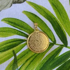 Buy an original Greek Pendant Gold Plated Phaistos Disk | Discover Greek Jewelry within a huge collection of Ancient Greek Jewelry | shipping worldwide This amazing piece of jewelry is representing the Ancient Greek Symbol so called Festos disc. Made of a mixing of silver 925 and 24k gold full filled plated.An excellent gift for women and also for men that would love to wear a geometric symbol. Size The diameter of the big disc is 3 cm approximately The thickness is 1,2mm Chains You can choose w Ancient Greek Symbols, Greek Necklace, Greek Jewellery, Photo Chain, Ancient Greek Jewelry, Ancient Greek Mythology, Greek Symbol, Geometric Symbols, Minimal Necklace