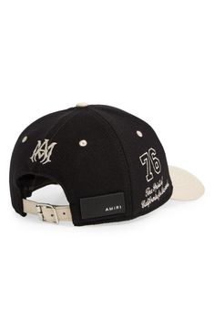 a black and white hat with the number seventy on it's front, which is embroidered