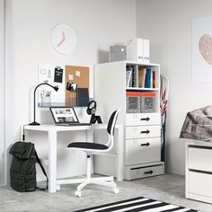 a white desk and chair in a room