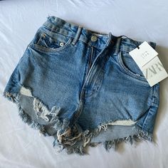 Size: 2 Color: Blue Never Worn Before, Tags Still On Summer Denim Blue Jeans With Frayed Hem, Chic Blue Jean Shorts With Pockets, Blue Cutoff Jeans For Summer, Chic Blue Cutoff Jeans, Summer Blue Jeans Short Length, Blue Summer Jeans, Blue Ripped Jean Shorts For Spring, Ripped Blue Jean Shorts For Spring, Blue Denim Jean Shorts For Summer