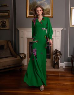 Make a bold and elegant statement with this vibrant green dress, adorned with intricate floral embellishments that add a touch of whimsy and sophistication. The dress features a flattering V-neckline and gracefully flowing silhouette that complements the wearer's figure, making it an ideal choice for special occasions where you want to stand out. The long sleeves and detailed floral accents throughout the dress bring a sense of luxury and artistry, while the tailored fit ensures comfort and elegance. Whether you're attending a wedding, gala, or any formal event, this dress offers a unique blend of classic style and contemporary flair. Complete your look with delicate accessories and heels to enhance the dress's stunning details. Elevate your wardrobe with this exquisite piece that combines Fitted Green Evening Dress With Floral Embroidery, Green Fitted Evening Dress With Floral Embroidery, Spring Green Evening Dress For Wedding, Dark Green Evening Dress For Spring, Spring Green Wedding Evening Dress, Green Spring Wedding Evening Dress, Elegant Green Dress With Floral Applique, Green Floral Embroidered Evening Dress For Party, Elegant Green Evening Dress With Floral Embroidery