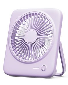 a small purple fan sitting on top of a table