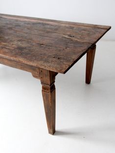 an old wooden table on a white background