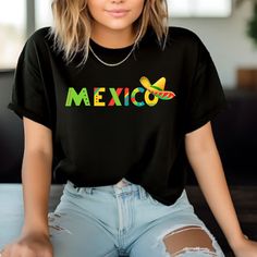 This classic unisex Mexican shirt,  jersey short sleeve tee fits like a well-loved favorite. Soft cotton and quality print make users fall in love with it over and over again. These t-shirts have-ribbed knit collars to bolster shaping. The shoulders have taping for better fit over time. Dual side seams hold the garment's shape for longer.  .: 100% Airlume combed and ringspun cotton (fiber content may vary for different colors) .: Light fabric (4.2 oz/yd² (142 g/m .: Retail fit .: Tear away label .: Runs true to size Cinco De Mayo Screen Print Crew Neck T-shirt, Pre-shrunk Short Sleeve T-shirt For Cinco De Mayo, Casual Cotton Shirt For Cinco De Mayo, Cinco De Mayo Graphic Tee With Short Sleeves, Cinco De Mayo Graphic T-shirt, Casual Short Sleeve Shirt For Cinco De Mayo, Cotton Graphic Tee For Cinco De Mayo, Cinco De Mayo Graphic Cotton T-shirt, Black Crew Neck T-shirt For Cinco De Mayo