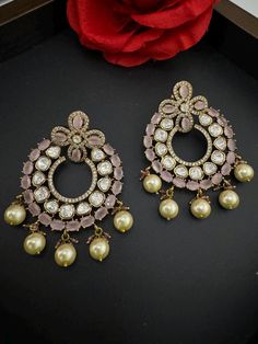 This a beautiful Premium gold Long Chandbali earring Premium Moissanite Kundan and Cubic Zirconia detailed work with All natural Stones is very light weighted. It is a statement earring with stunning designer look which makes it a must to have in your collection. This is so beautiful to look at and a perfect one for Indian weddings.  Color : Pink length : 2.75 inch width : 2 inch Each earring Weight : 18.7 grams Material : Brass , Natural Stones, Cubic Zirconia, Moissanite Kundan Beautiful High Luxury Chinon Chandbali Saree, Luxury Stone Work Chandbalis For Wedding, Luxury Chandbali Jeweled Danglers, Festive Jeweled Chandbali Chandelier Earrings, Wedding Chandbali Bridal Earrings With Jewels, Wedding Bridal Chandbali Earrings With Jewels, Chandbali Jeweled Bridal Earrings For Reception, Jeweled Chandbali Bridal Earrings For Reception, Stone Work Chandbali Chandelier Earrings For Celebration