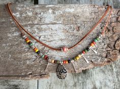 This uniquely designed short necklace is lightweight multi-strand short Boho/Tribal  in a gorgeous mix of colors. Dress it up or down, it will always be perfect!  Made from Ethnic seed beads, barrel bead, tierra cast charms, silver plated spacer beads, natural Kangaroo leather lace and cord. Size options available: Short strand measures 39cm, second strand 42.5, fitted with a 4cm extension chain. Or Short strand measures 41.4cm, second strand 44.5, fitted with a 4cm extension chain. Bohemian Pendant Choker, Adjustable Boho Collar Necklace For Festivals, Bohemian Adjustable Pendant Choker, Adjustable Bohemian Pendant Choker, Bohemian Layered Choker Necklace, Bohemian Boho Choker Necklace, Bohemian Boho Collar Choker Necklace, Bohemian Choker Necklace With Boho Collar, Adjustable Boho Collar Hippie Necklace