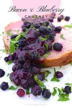 a piece of bread with blueberries on it and the words bacon & blueberry chutney