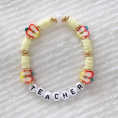 It's back to school! ️ This bracelet is a super sweet gift for your teacher AND a great way to show off your teacher pride if you are one! Each is handmade to order. As an appreciation to our teachers, we will offer 20% off to teachers placing orders for teacher bracelets. (offer cannot be combined with perk below)  Details: black on white letter beads, cream color heishi beads with apple and cold accents. 🍎  PERKS: Buy 3 or more bracelets, any combo, from our store for 15% off! Multicolor Adjustable Jewelry For Teacher Appreciation, Personalized Multicolor Bracelets For School, Personalized Multicolor Beaded Bracelets For School, Customizable Adjustable Jewelry For School, Personalized Adjustable Bracelets For Teacher Appreciation, Personalized Adjustable Bracelet For Teacher Appreciation, Trendy Personalized Jewelry For School, Multicolor Adjustable Beaded Bracelets For Teacher Appreciation, Adjustable Multicolor Beaded Bracelets For Teacher Appreciation