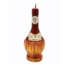 a bottle that is sitting in the shape of a vase with a candle inside it