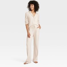 After a long day, you'll love winding down and getting some rest in this Ribbed Split Long-Sleeve Notch Collar Shirt and Pants Pajama Set from Auden™. The pajama set includes a long-sleeve shirt with a notched collar, a chest patch pocket, a full-length button-down front and side slits. It’s paired with matching pajama pants with an elastic waistband with a drawstring for a customizable fit. Made of a rayon-spandex blend with a ribbed texture, this solid-color PJ set helps you enjoy a good night Notch Collar Shirt, Elastic Waistband Pants, Pajama Pant, Matching Pajamas, Notch Collar, Collar Top, Short Pajama Set, Knit Shorts, Collar Shirt